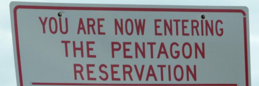 a street sign that says, "YOU ARE NOW ENTERING THE PENTAGON RESERVATION"